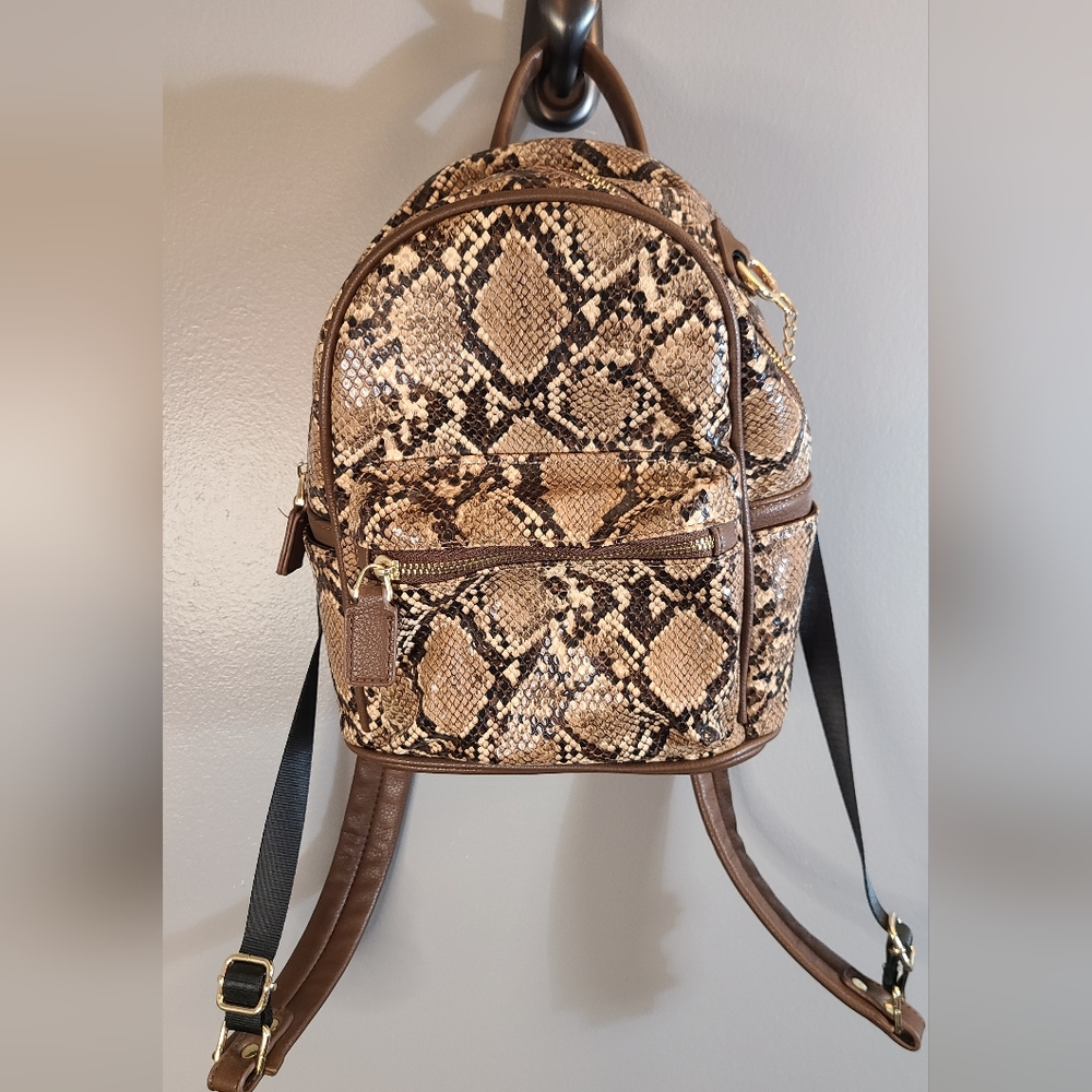 Like Dreams Faux brown snakeskin backpack. *missing fuzzy dangle in pictures